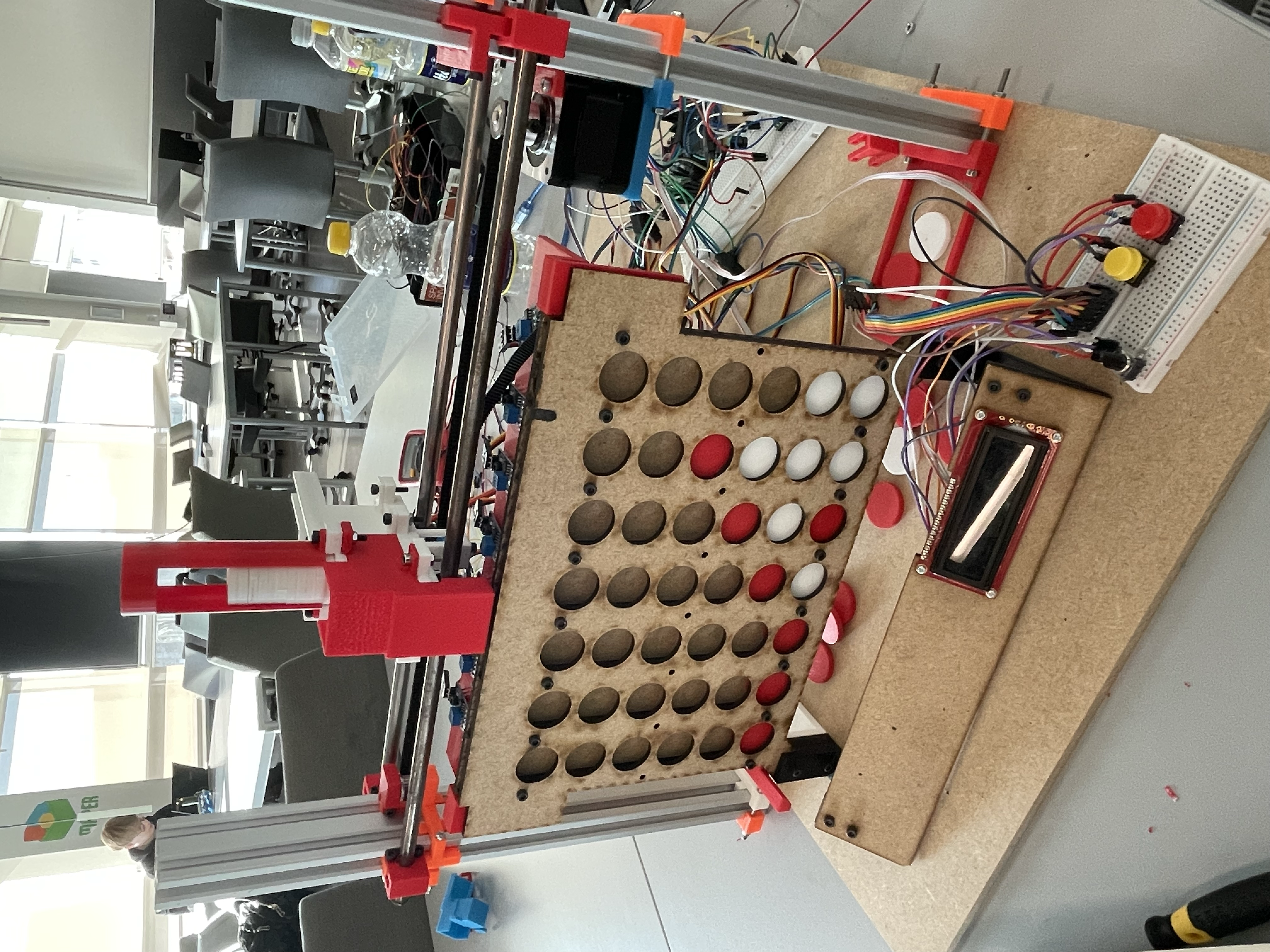 Custom-built autonomous Connect Four robot with a motorised carriage and disc dispenser